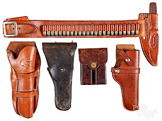 Three leather holsters, etc.