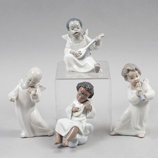 Lote de figuras de niños ángeles con instrumentos musicales. Elaborados en porcelana Lladró acabado brillante. Piezas: 4
