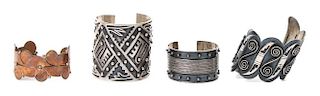 Three Mexican Silver Cuff Bracelets Length of largest bracelet 6 3/4 x opening 1 x width 2 5/8 inches.
