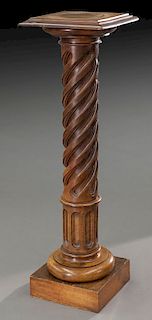 Spiral turned and fluted wooden display pedestal.