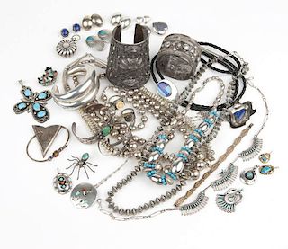 A large group of silver and metal jewelry
