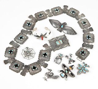 A group of silver Native American items