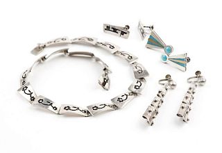 A group of silver and stone inlay jewelry