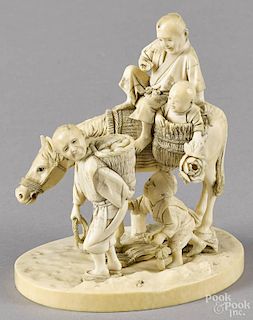 Japanese Meiji period carved ivory group of men and children with a horse, 4 1/4'' h.
