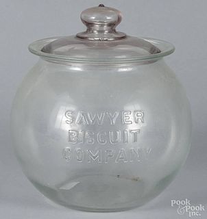 Clear glass Sawyer Biscuit Company counter jar, early 20th c., 11'' h.
