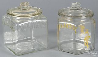 Two clear glass Planters Peanuts counter jars, 20th c., 9 1/2'' h.