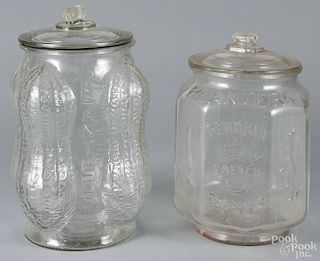 Two clear glass Planters Peanuts counter jars, 20th c., 14 1/2'' h. and 12 1/2'' h.