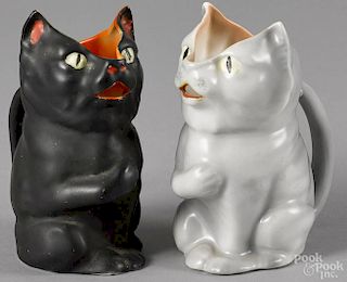 Two Royal Bayreuth porcelain cat creamers, to include a black cat and a white cat with a blue mark