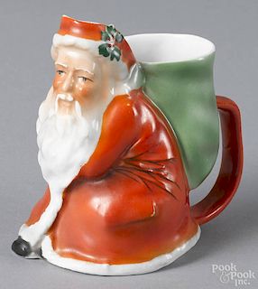 Royal Bayreuth porcelain Santa Claus cream pitcher with a blue mark on base, 4 1/4'' h.