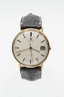 A GENTS 9ct GOLD OMEGA STRAP WATCH. Circular ivory dial wit