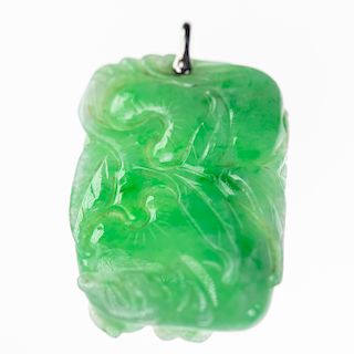 A JADEITE PENDANT, of carved rectangular form. In fitted ca