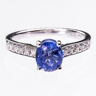 AN 18CT WHITE GOLD SAPPHIRE AND DIAMOND RING, the oval cut 