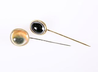 TWO TIGER'S EYE STICK PINS, LATE 19th CENTURY, each oval ca