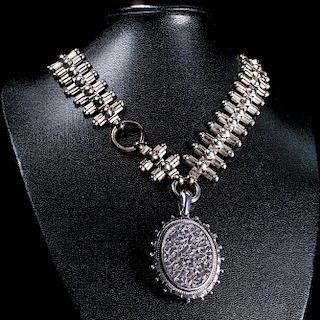 A VICTORIAN SILVER LOCKET SUSPENDED FROM A FANCY LINK COLLA