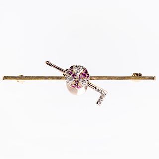 A DIAMOND AND RUBY SET BROOCH, set to the centre of the rec