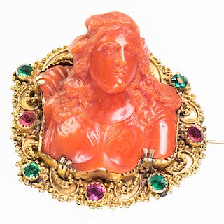 A CARVED CORAL BROOCH, the coral carved depicting a maiden 