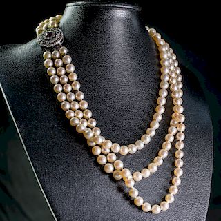 A CULTURED PEARL, RUBY AND DIAMOND NECKLACE, the three grad