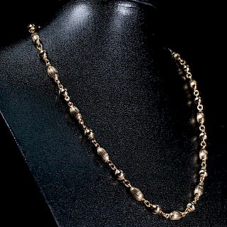 A 9CT YELLOW GOLD CHAIN, of ball shaped articulated links o