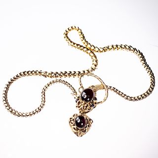 A MID VICTORIAN GARNET SET NECKLACE, the snake link chain m