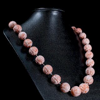 A CARVED CORAL NECKLACE, the thirty-two graduating carved c