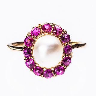 A CULTURED PEARL AND RUBY RING, the single cultured pearl r