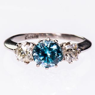 AN AQUAMARINE AND DIAMOND RING, the round cut aquamarine se