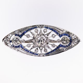 AN EDWARDIAN DIAMOND AND SAPPHIRE BROOCH, the navette style