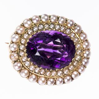 A LATE VICTORIAN AMETHYST AND SEED PEARL BROOCH, the oval c