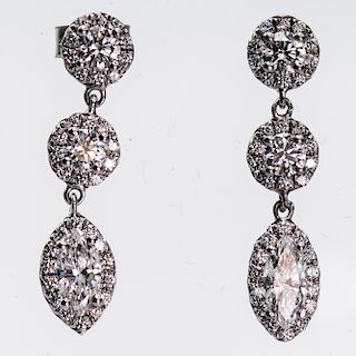 A PAIR OF CONTEMPORARY DIAMOND EARRINGS, of three articulat