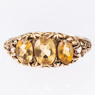 A 9CT YELLOW GOLD CITRINE RING, the three oval cut citrines