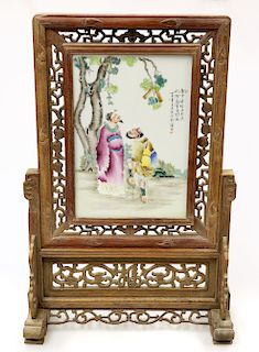 A CHINESE PORCELAIN TABLE SCREEN, the panel painted with tw