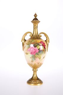 A ROYAL WORCESTER VASE AND COVER, the two-handled ovoid bod