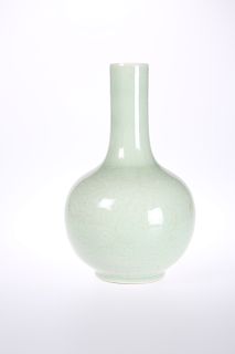 A CHINESE CELADON VASE, bottle shaped, decorated with scrol