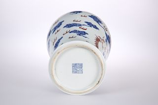 A CHINESE PORCELAIN BALUSTER VASE, painted in blue and aube