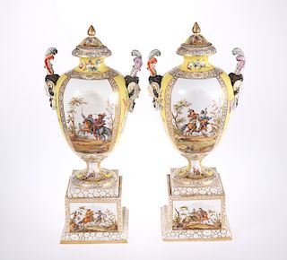 A LARGE PAIR OF DRESDEN YELLOW GROUND VASES, COVERS AND STA