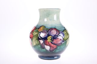 A WALTER MOORCROFT POTTERY VASE, tubelined and hand-painted