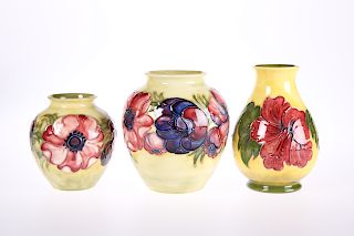 THREE MOORCROFT POTTERY VASES, two tubelined and hand-paint