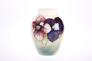 A WALTER MOORCROFT POTTERY VASE, tubelined and hand-painted