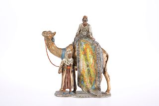 AN EARLY 20TH CENTURY PAINTED SPELTER TABLE LIGHTER, in the