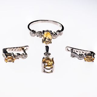 A 9CT WHITE GOLD AND CITRINE RING, the oval cut citrine set