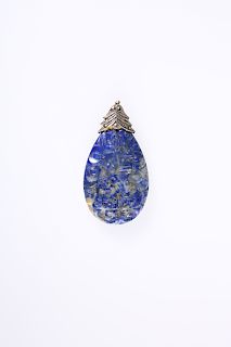 A CARVED LAPIS LAZULI PENDANT, of tear drop form, decorated