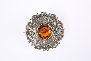 A LARGE SCOTTISH BROOCH, of thistle design, centred by a la