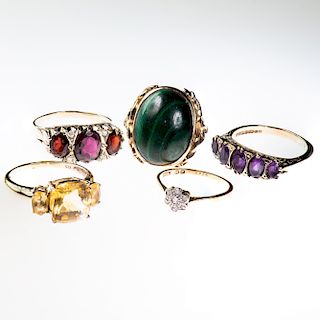 FOUR 9CT YELLOW GOLD AND GEM SET RINGS, to include garnet (