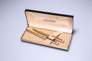 A CASED SHEAFFER GOLD-PLATED FOUNTAIN PEN AND BIRO, each wi