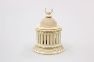 AN INDIAN IVORY TEMPLE FORM BOX, C.1900, with domed cover a