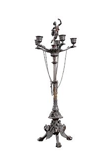 A CONTINENTAL PATINATED BRONZE FOUR LIGHT CANDELABRUM IN TH