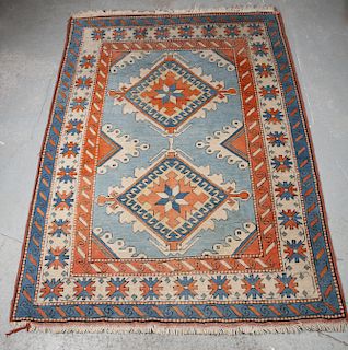 A TURKISH RUG, the centre with two lozenges. 216cm by 151.5