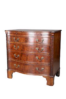 A GEORGE III STYLE MAHOGANY SERPENTINE CHEST OF DRAWERS, wi