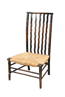 A LIBERTY & CO RUSH SEATED NURSING CHAIR, with wavy rails t
