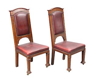 A PAIR OF GLASGOW SCHOOL OAK AND LEATHER HALL CHAIRS, each 